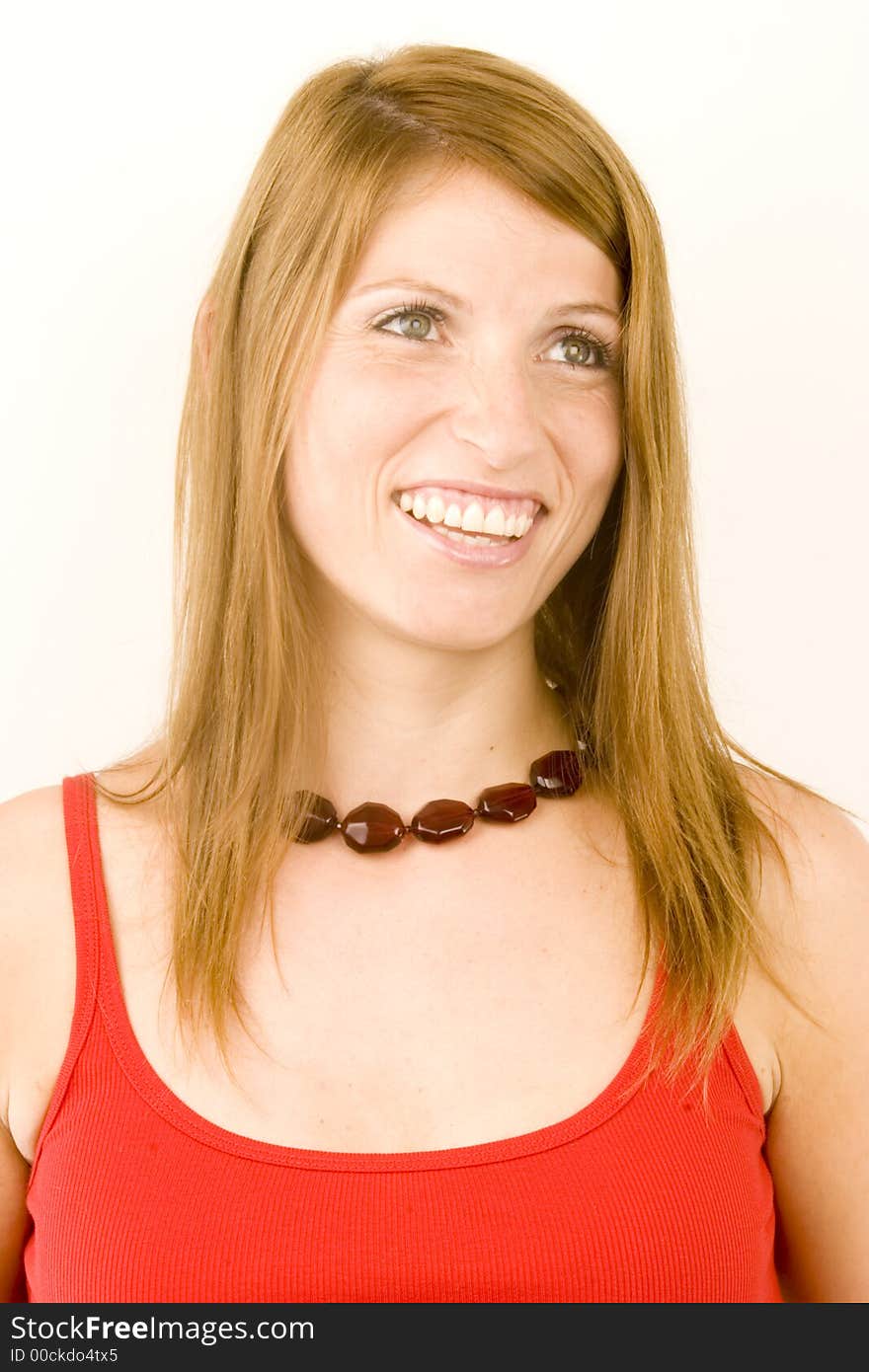 A portrait of a young woman against a plain background.