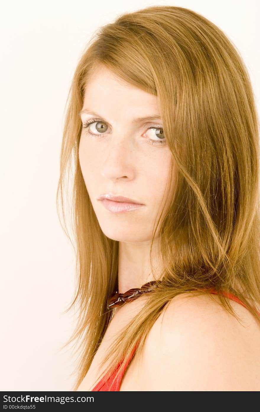 A portrait of a young woman against a plain background.