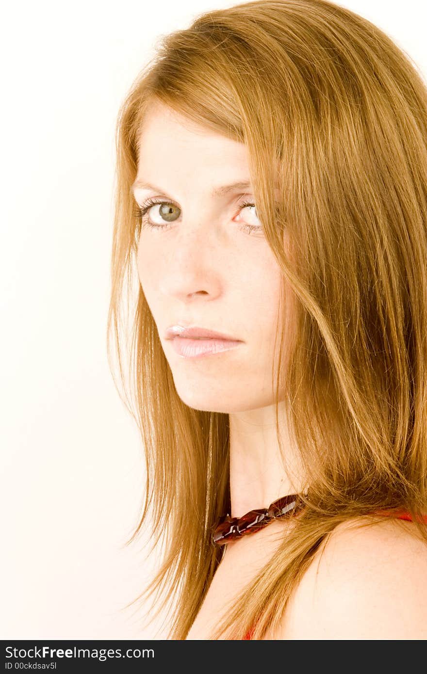 A portrait of a young woman against a plain background.