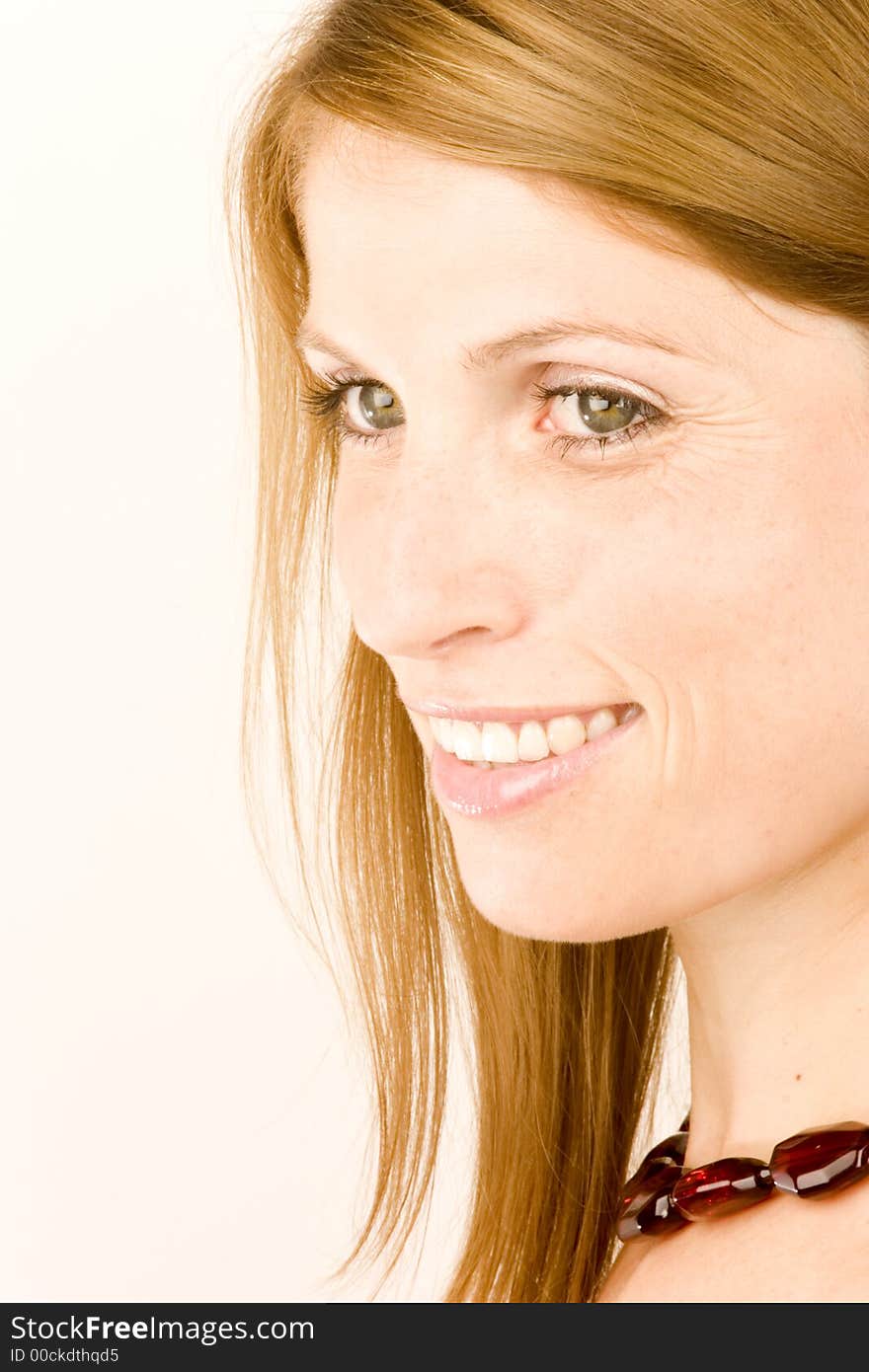 A portrait of a young woman against a plain background.