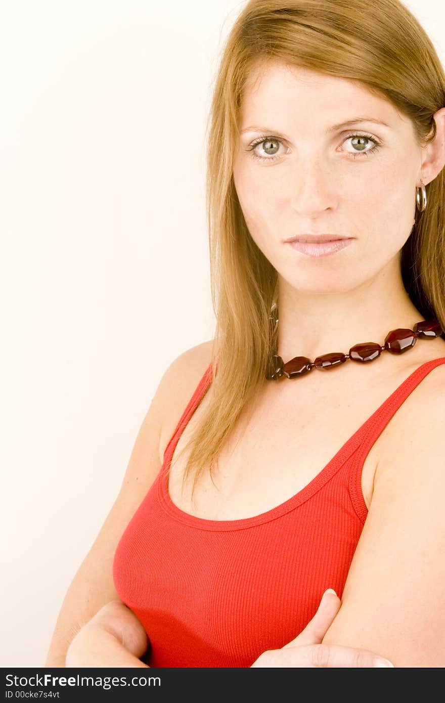 A portrait of a young woman against a plain background.