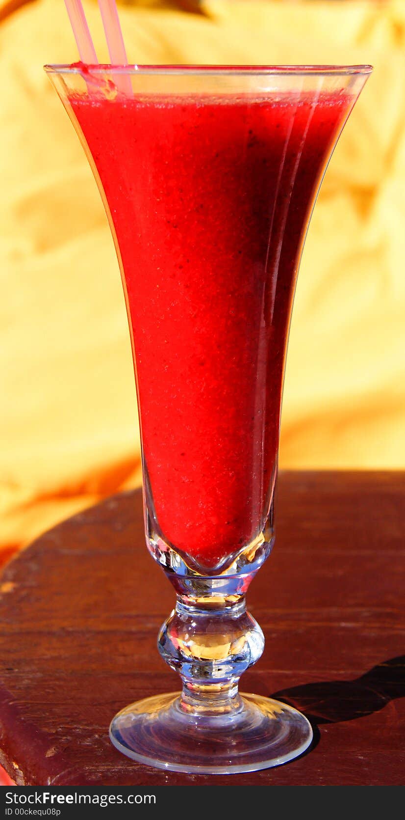 Red Strawberry Smoothie in a tall glass