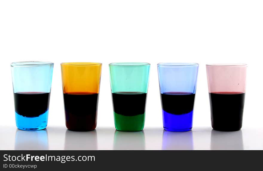 Close up of brightly colored drinking glasses with wine in them. Close up of brightly colored drinking glasses with wine in them