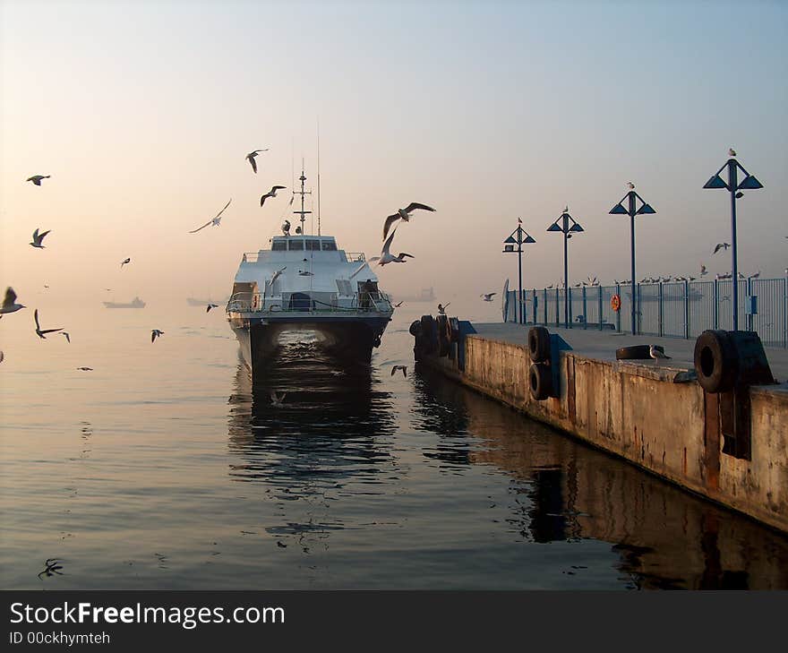 Sea bus is coming to wharf. Sea bus is coming to wharf