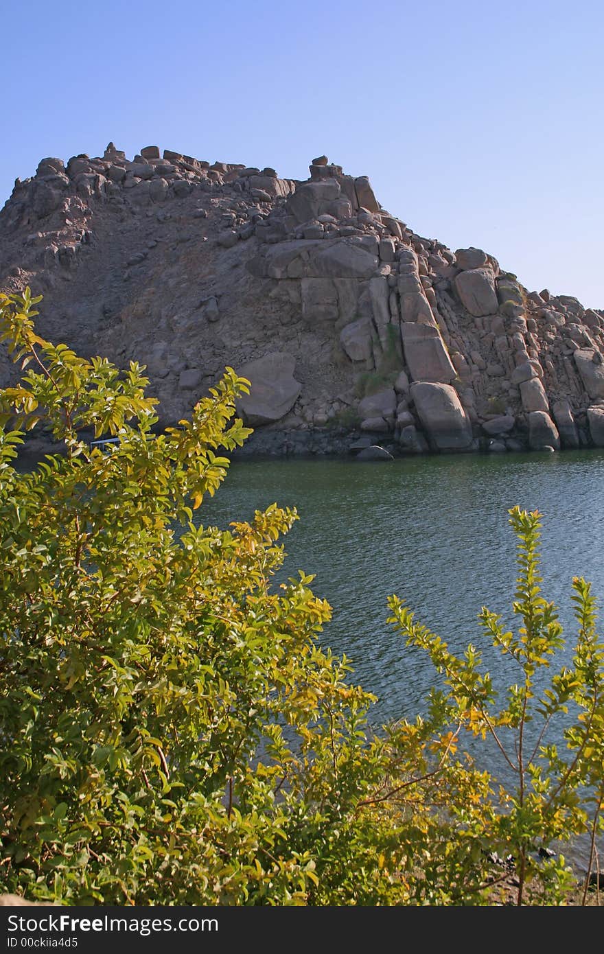 Green trees, Blue water and blue sky and Brown hill all gathered in one place as part of the beautiful nature of Aswan, Egypt. Green trees, Blue water and blue sky and Brown hill all gathered in one place as part of the beautiful nature of Aswan, Egypt.