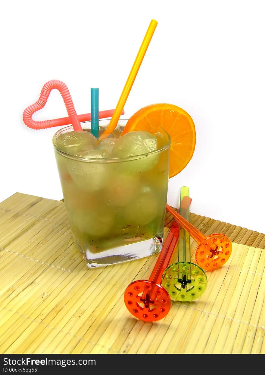 A colorful picture of a cocktail in a small glass with some decoration at the side. A colorful picture of a cocktail in a small glass with some decoration at the side