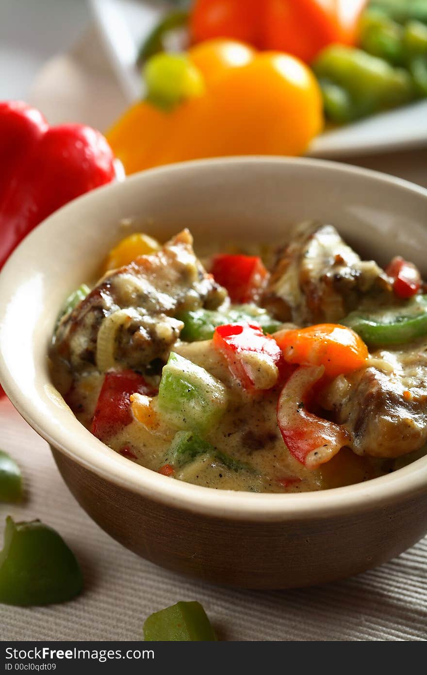 Tasty chicken with red, yellow and green pepper. Tasty chicken with red, yellow and green pepper