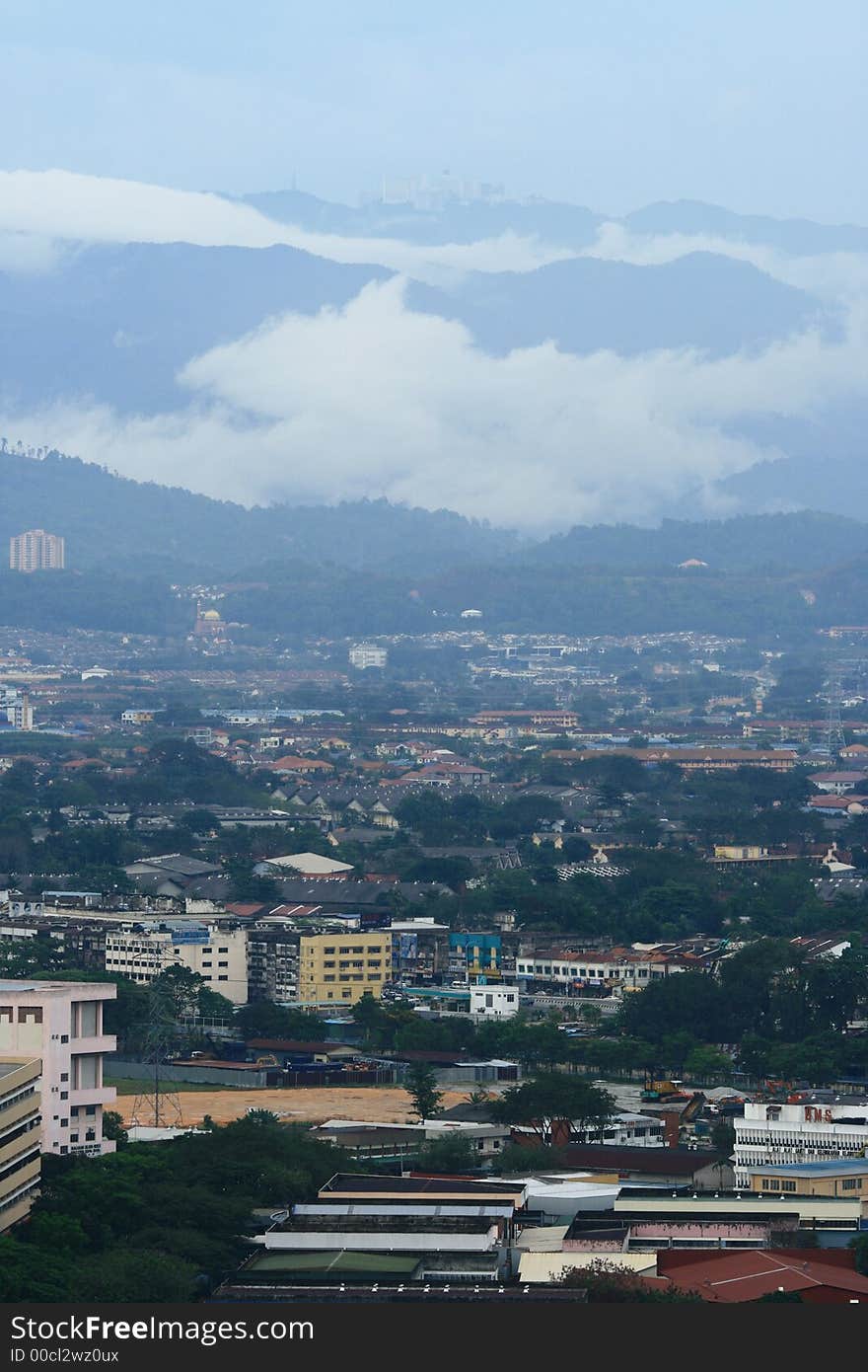 Small city landscape with a big resort city uphill