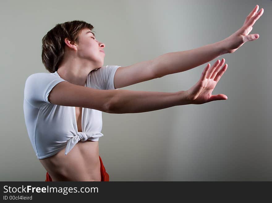 Attractive young woman doing exercises. With copy space