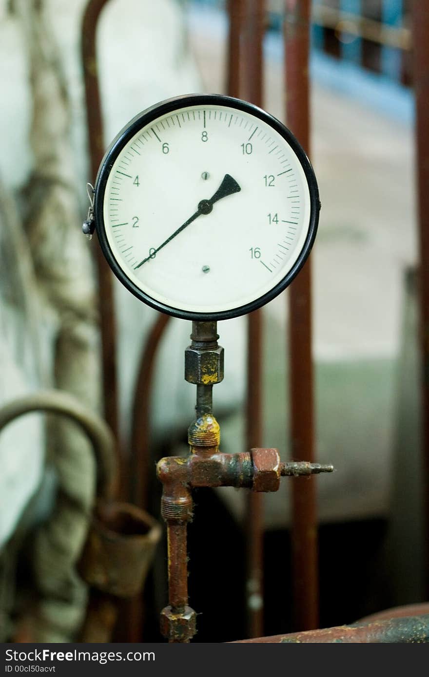 Antique pressure control device on the rusty pipe