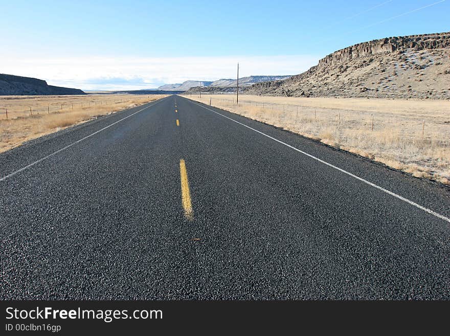 Straight fresh-paved desert highway; clean, crisp, sharp image. Straight fresh-paved desert highway; clean, crisp, sharp image.