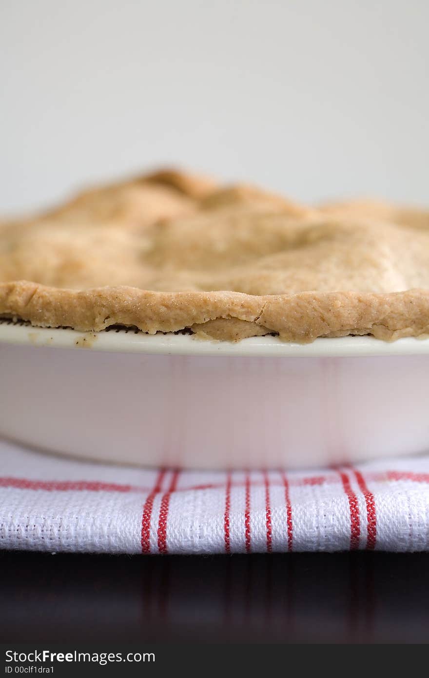 Fresh Baked apple Pie on a red and white kitchen towel