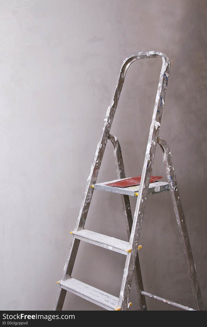 Boy with palette-knife near a ladder