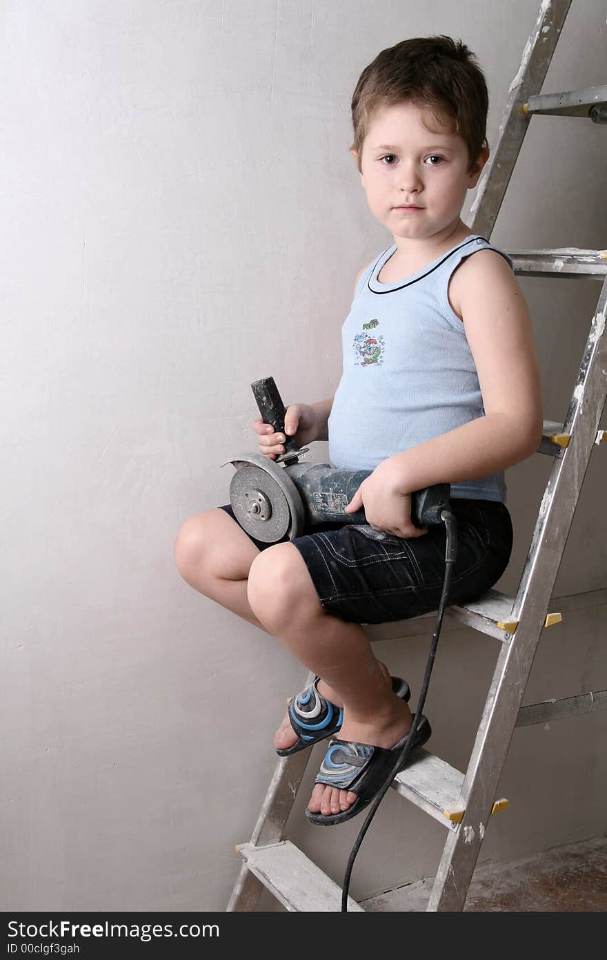 Boy with palette-knife near a ladder