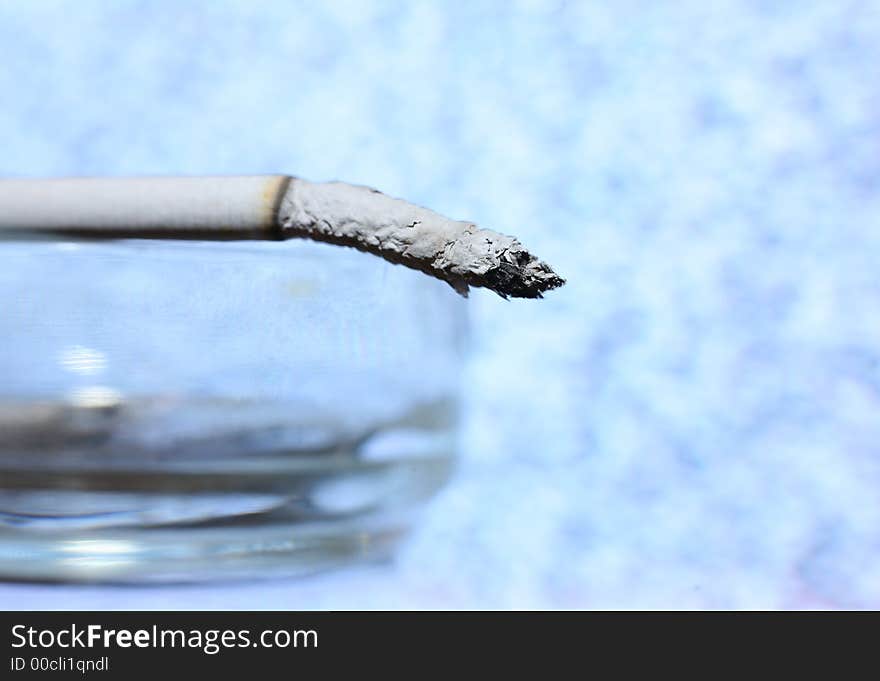 Cigarette close-up on a blue background