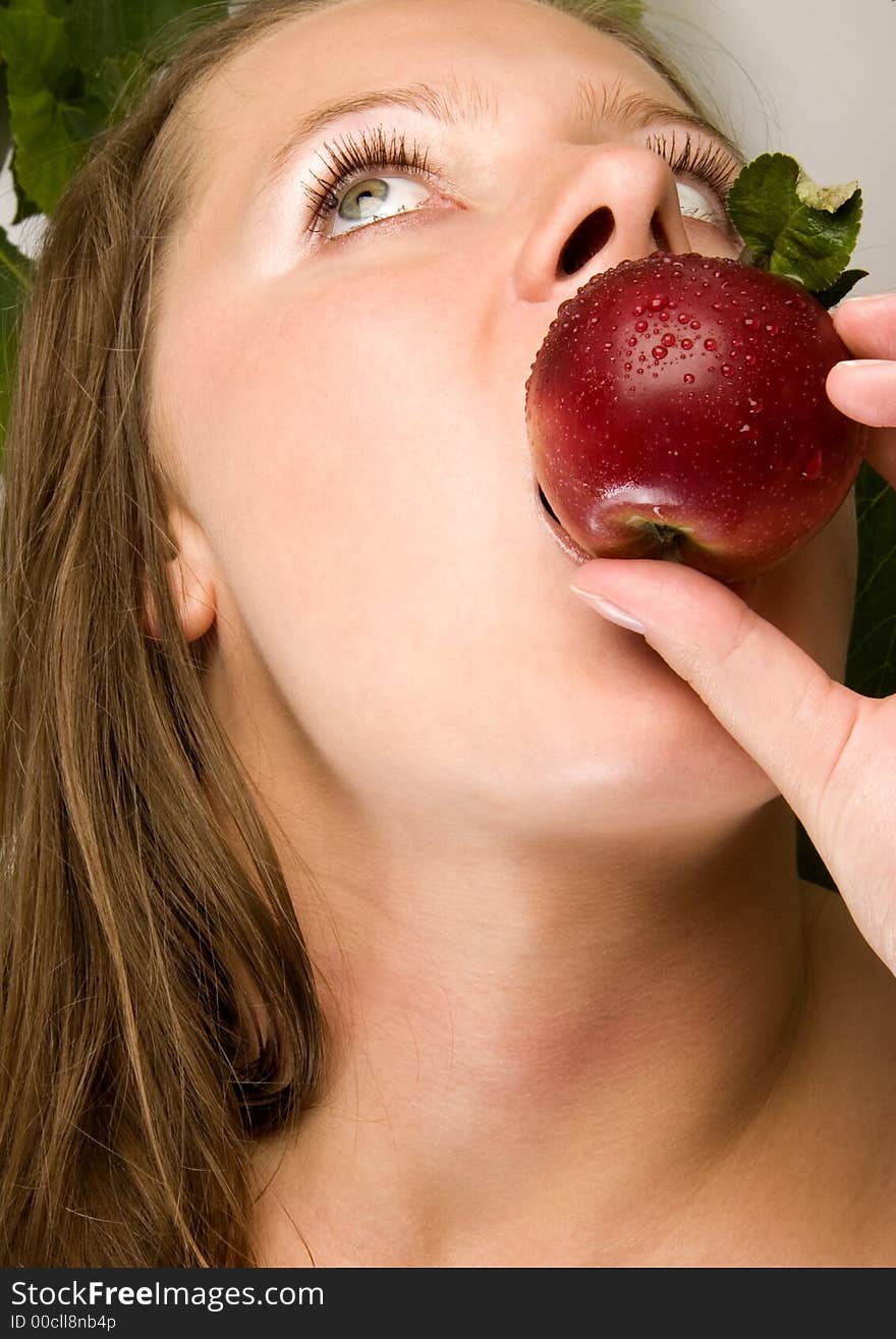 Beautiful young woman portrait with apple. Beautiful young woman portrait with apple