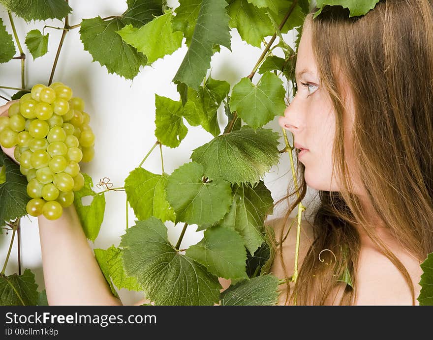 Beautiful young woman portrait with green grape. Beautiful young woman portrait with green grape