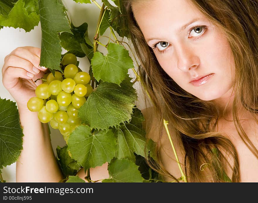 Beautiful young woman portrait with green grape. Beautiful young woman portrait with green grape