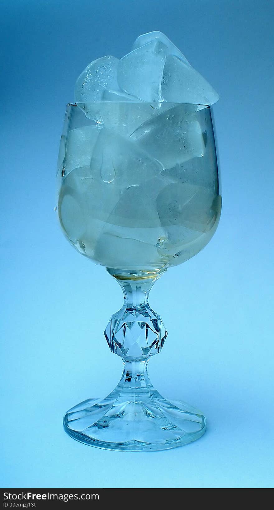 Ice and Glass of clean water in wineglass