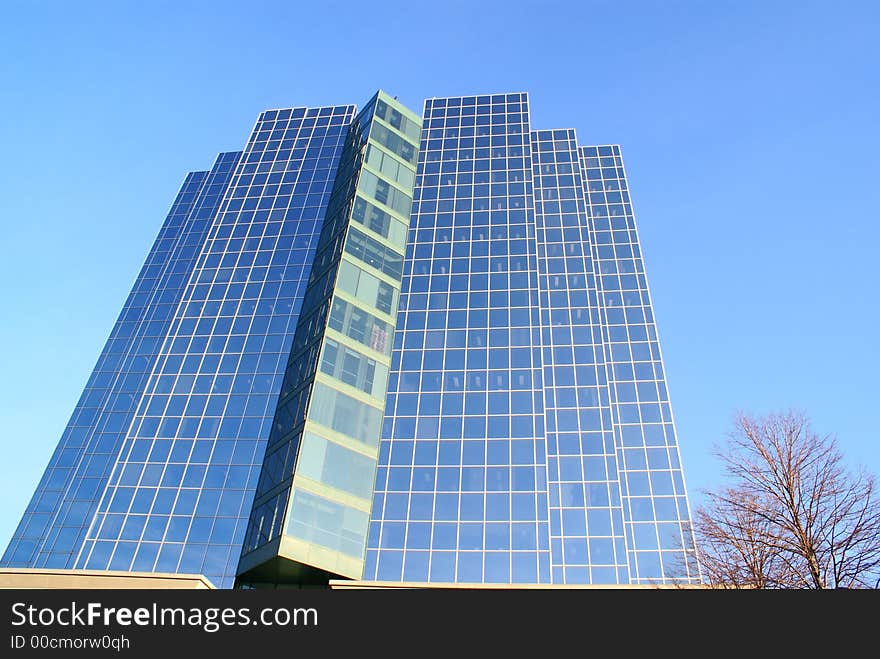 Photo of a reflection of a building in downtown