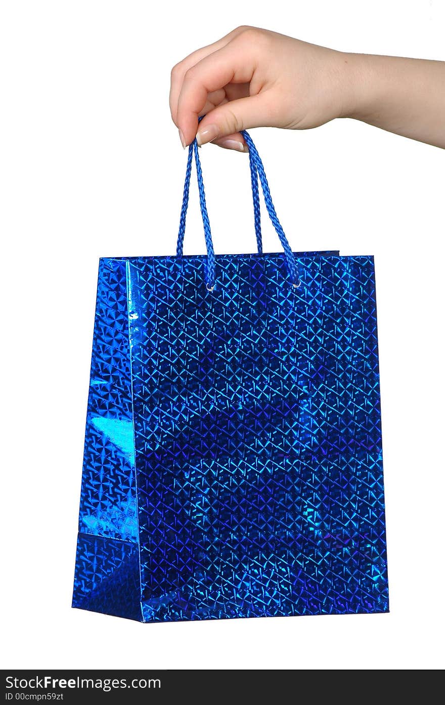 Blue package with a gift in a hand on a white background