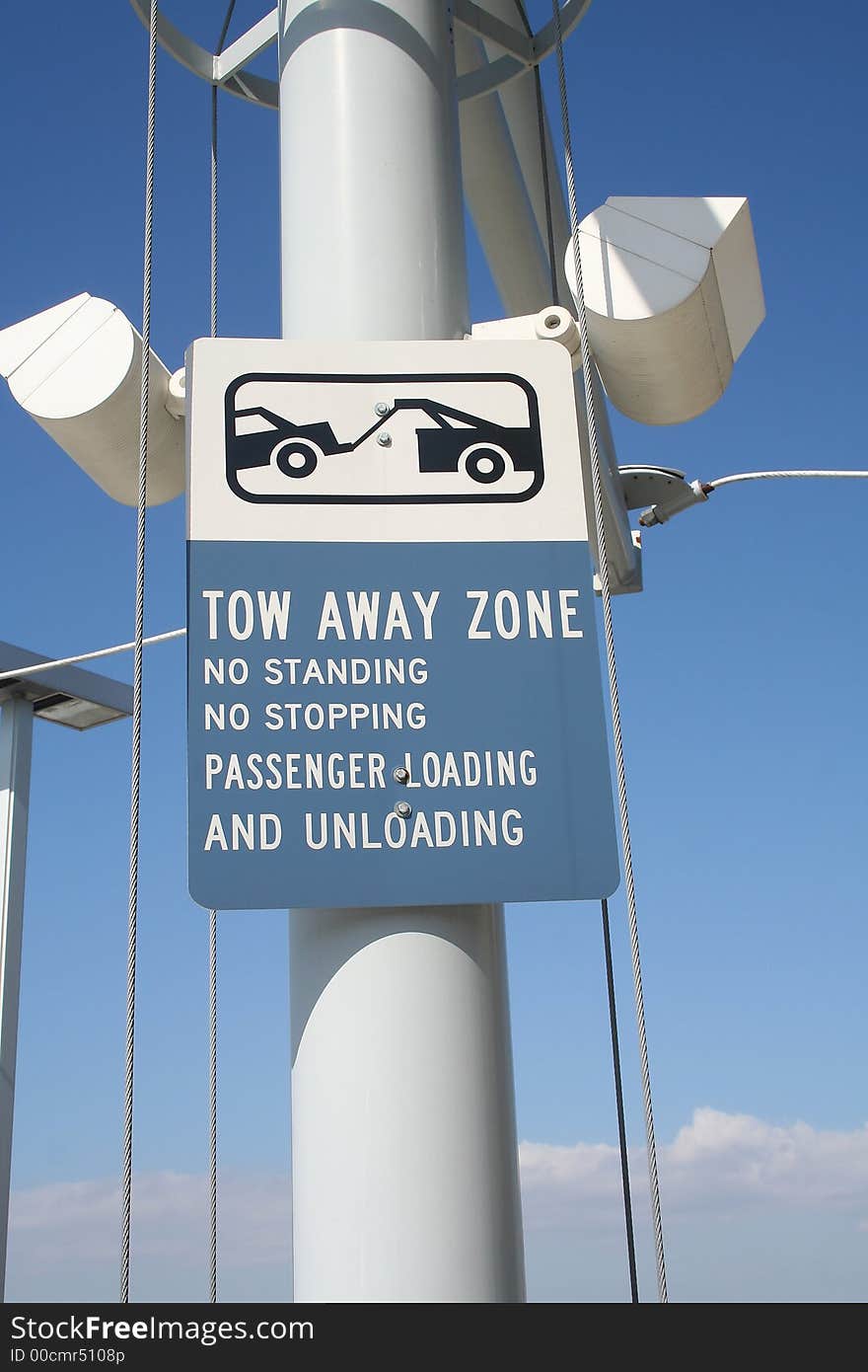 A tow away zone sign at an airport in south Florida