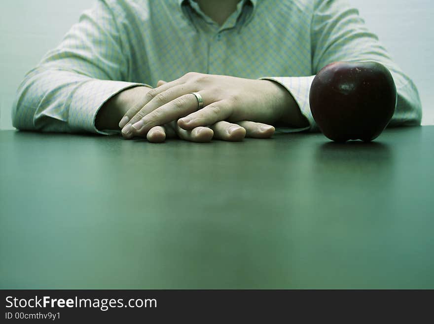 Male Hands And An Apple