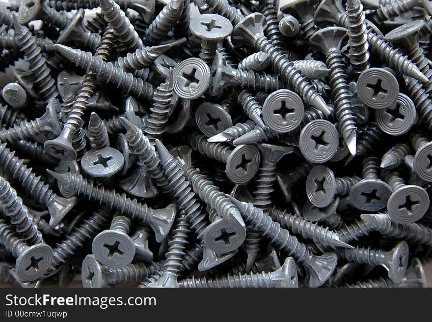 Screws scattered in a box