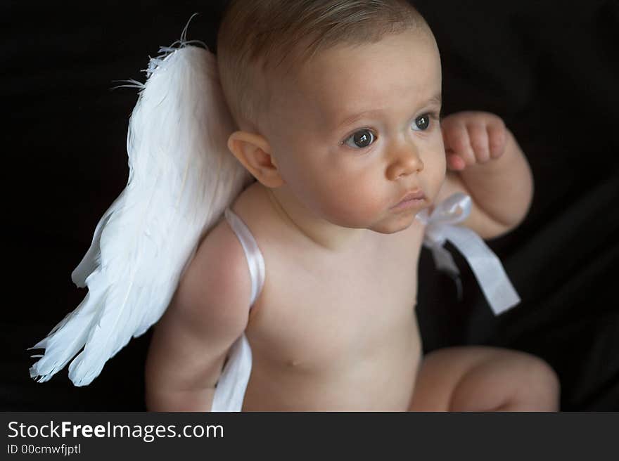 Image of baby wearing angel wings. Image of baby wearing angel wings