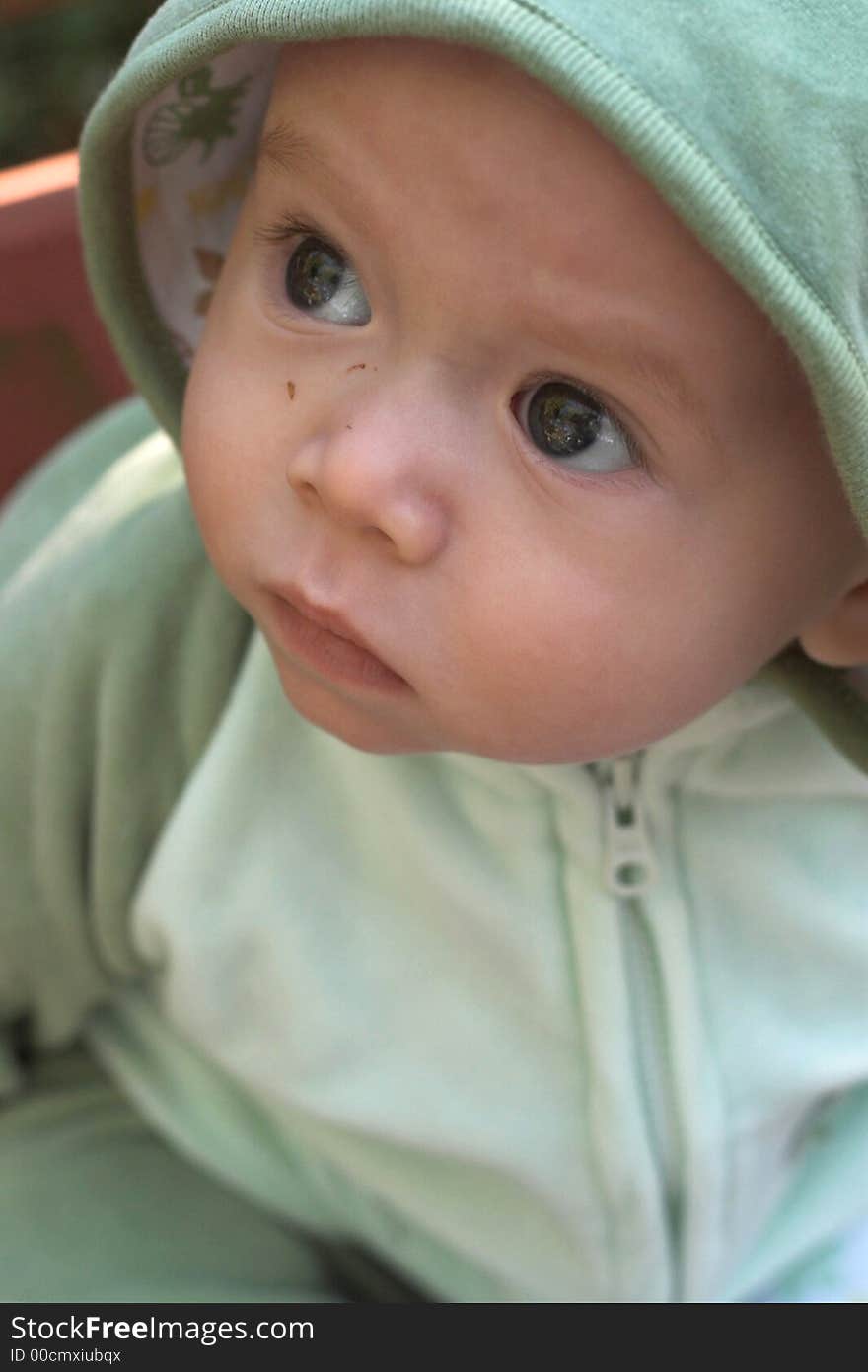 Image of cute baby wearing a hooded jacket. Image of cute baby wearing a hooded jacket