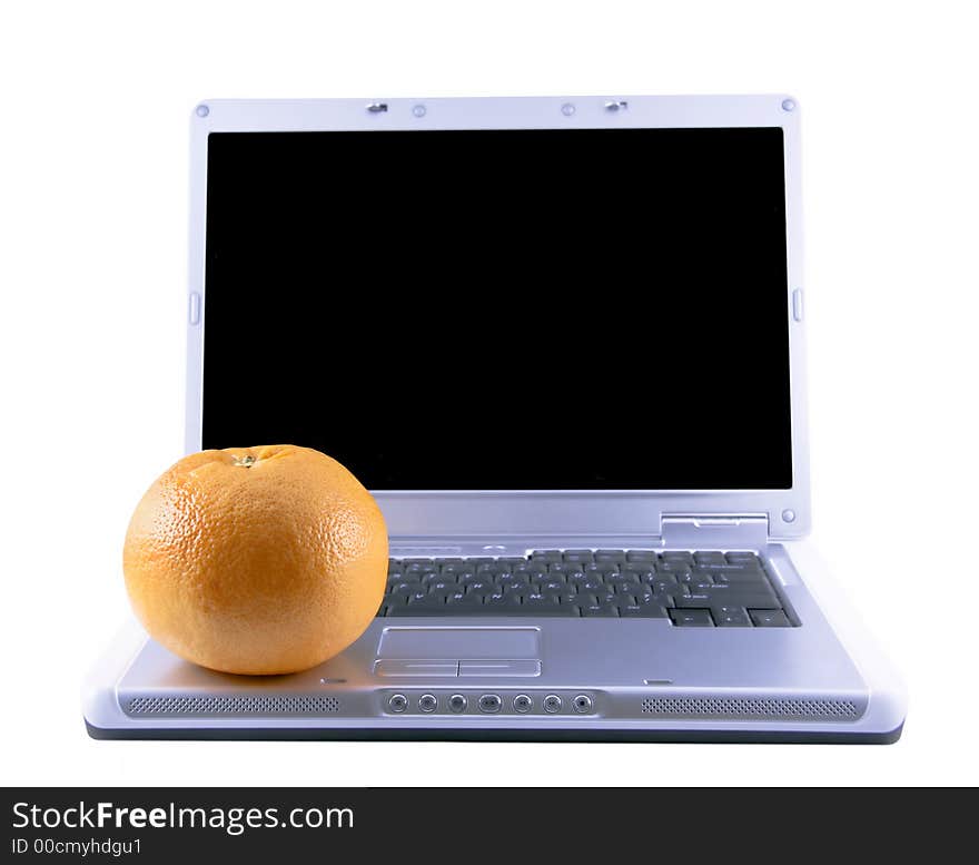 Laptop and grapefruit selected on a white background