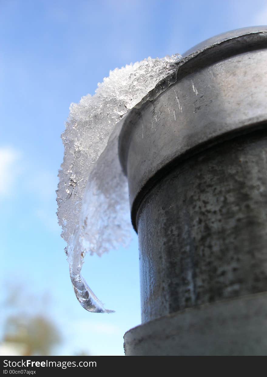 Snow and ice formation on metal pole. Snow and ice formation on metal pole