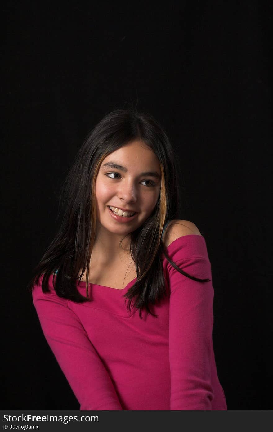 Teen Posing Over Black Backdrop