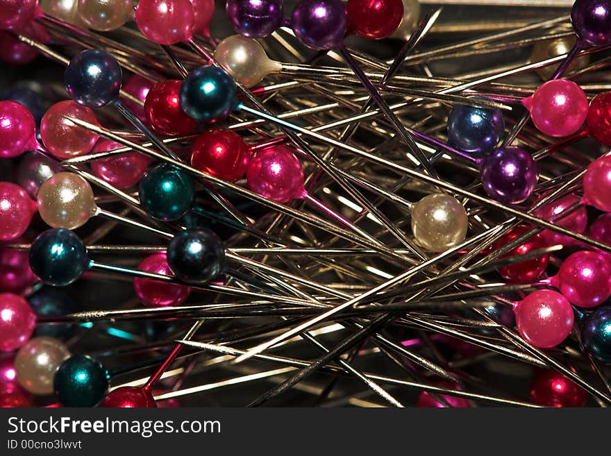 Steel pins with beautiful heads, (studio, halogen light). Steel pins with beautiful heads, (studio, halogen light).