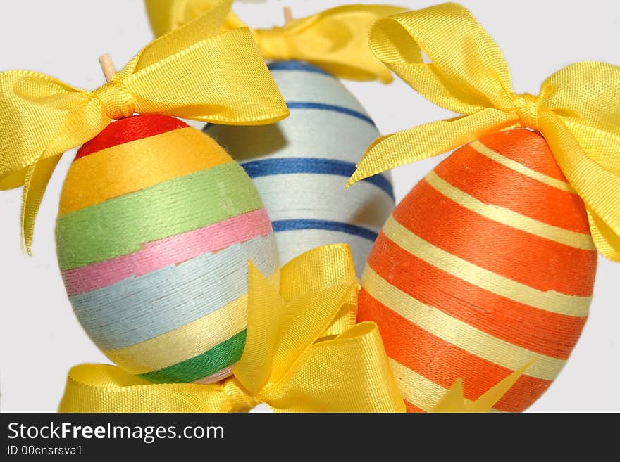 Colorful easter eggs with yellow bows