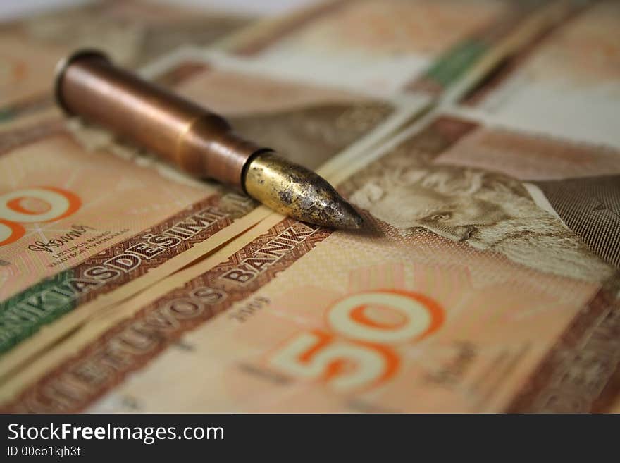 Bullet Placed On Money