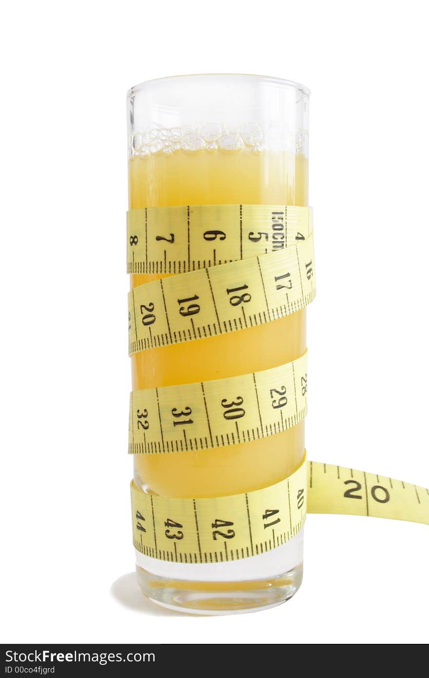 Glass of juice and measuring tape. Glass of juice and measuring tape