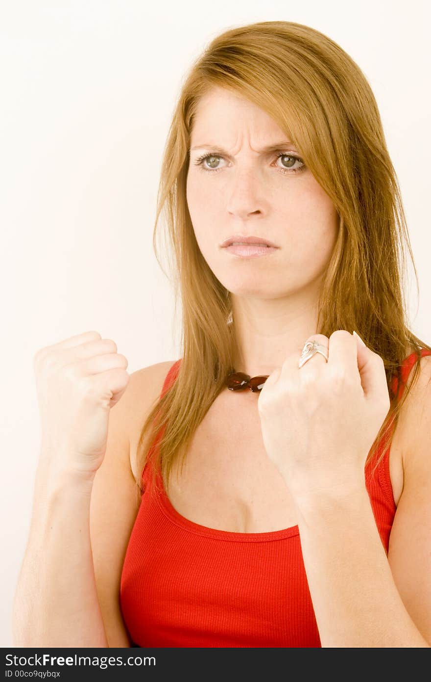 A portrait of a young woman against a plain background.