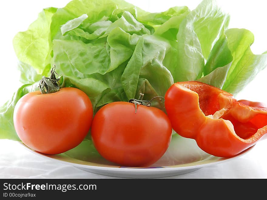 Fresh vegetables against white background