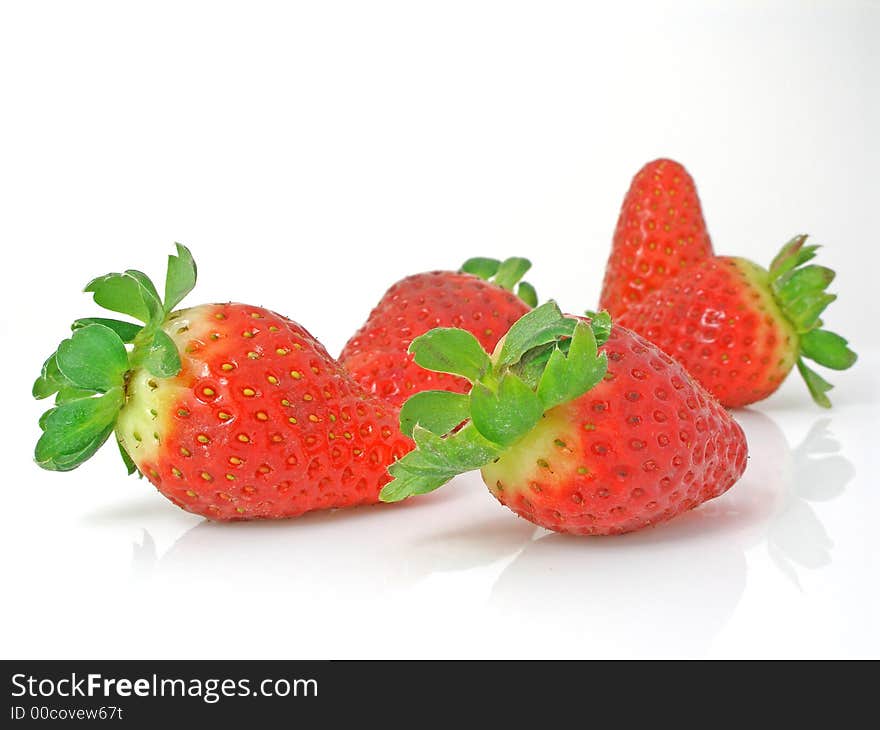 Strawberries on a gleamy surface. Strawberries on a gleamy surface