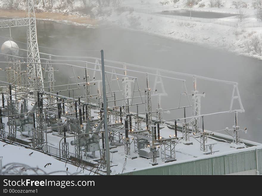 Power plant below the dam on the river. Power plant below the dam on the river.