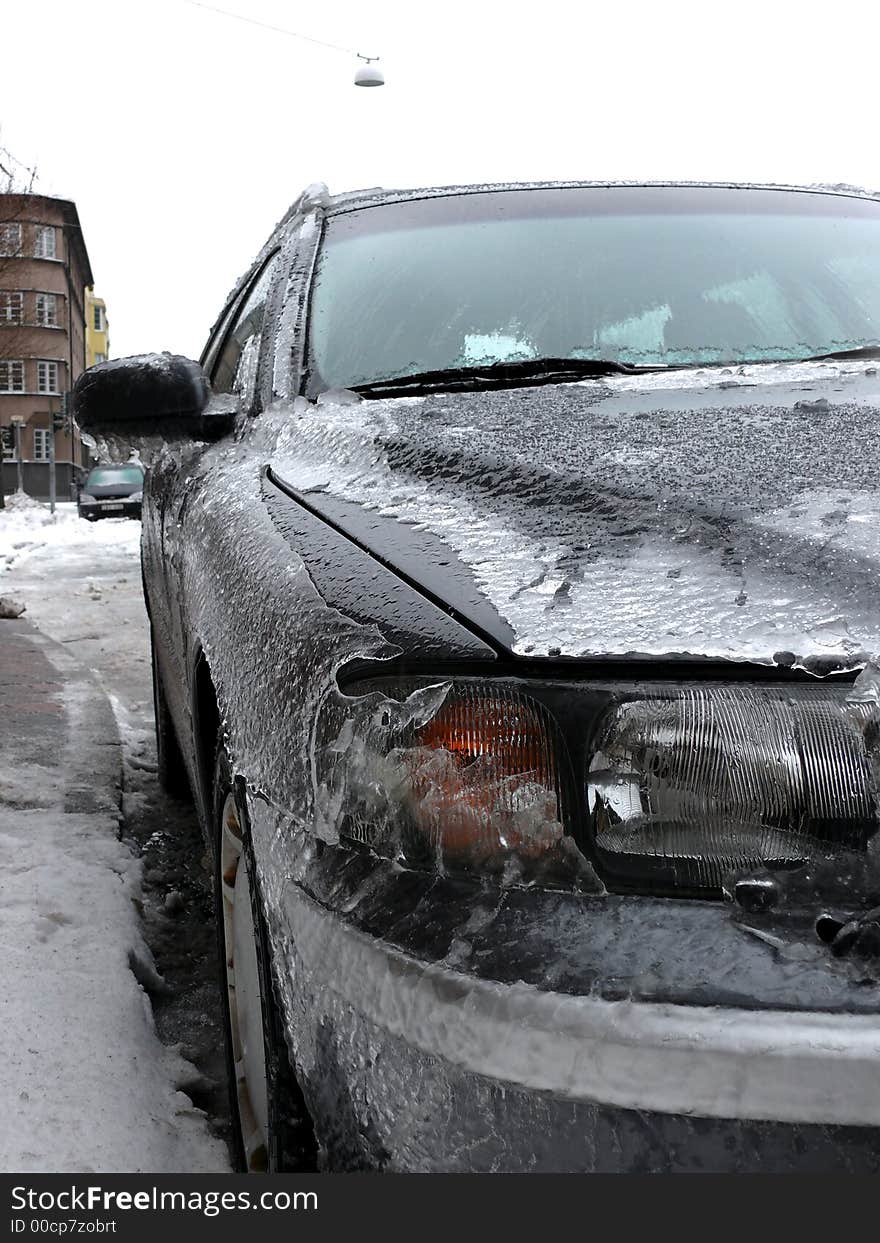 Portrait of modern car covered in ice. Portrait of modern car covered in ice