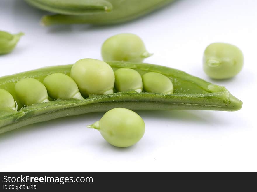 Cut green sweet peas with seeds