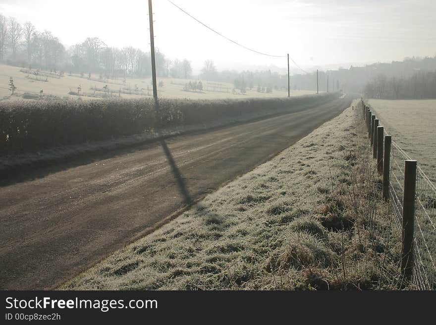 Lonely rural road early on a winters morning of freezing mist. Lonely rural road early on a winters morning of freezing mist