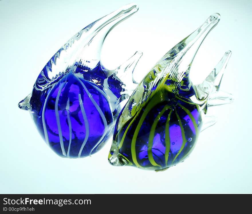 Two glowing colorful blown glass angel fish