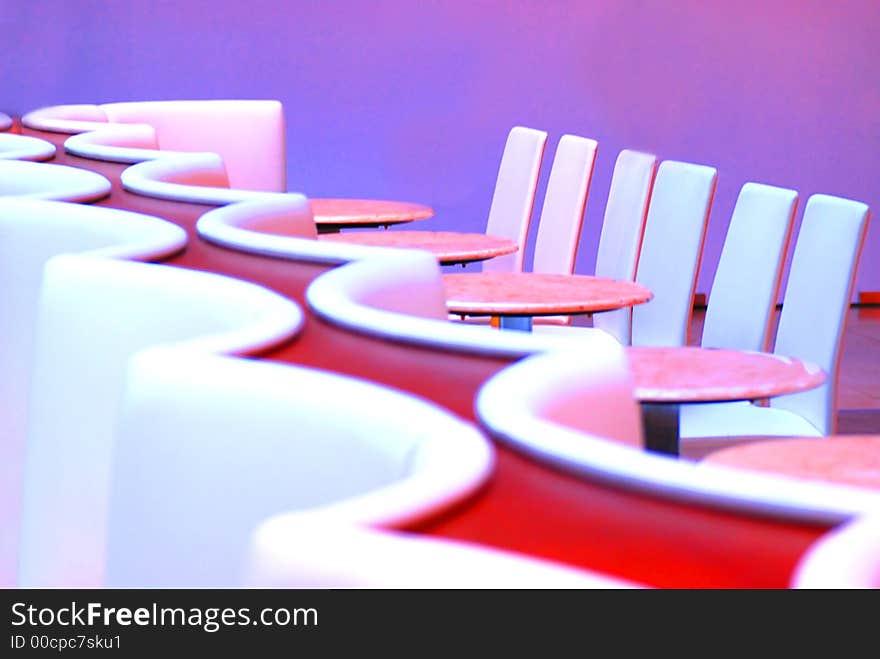 A couch and tables in a cafe. A couch and tables in a cafe