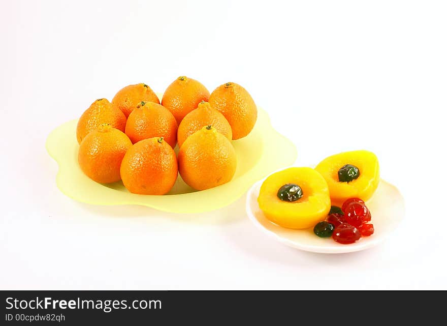 Isolated photo of fruits selections peach orange and glaced cherries