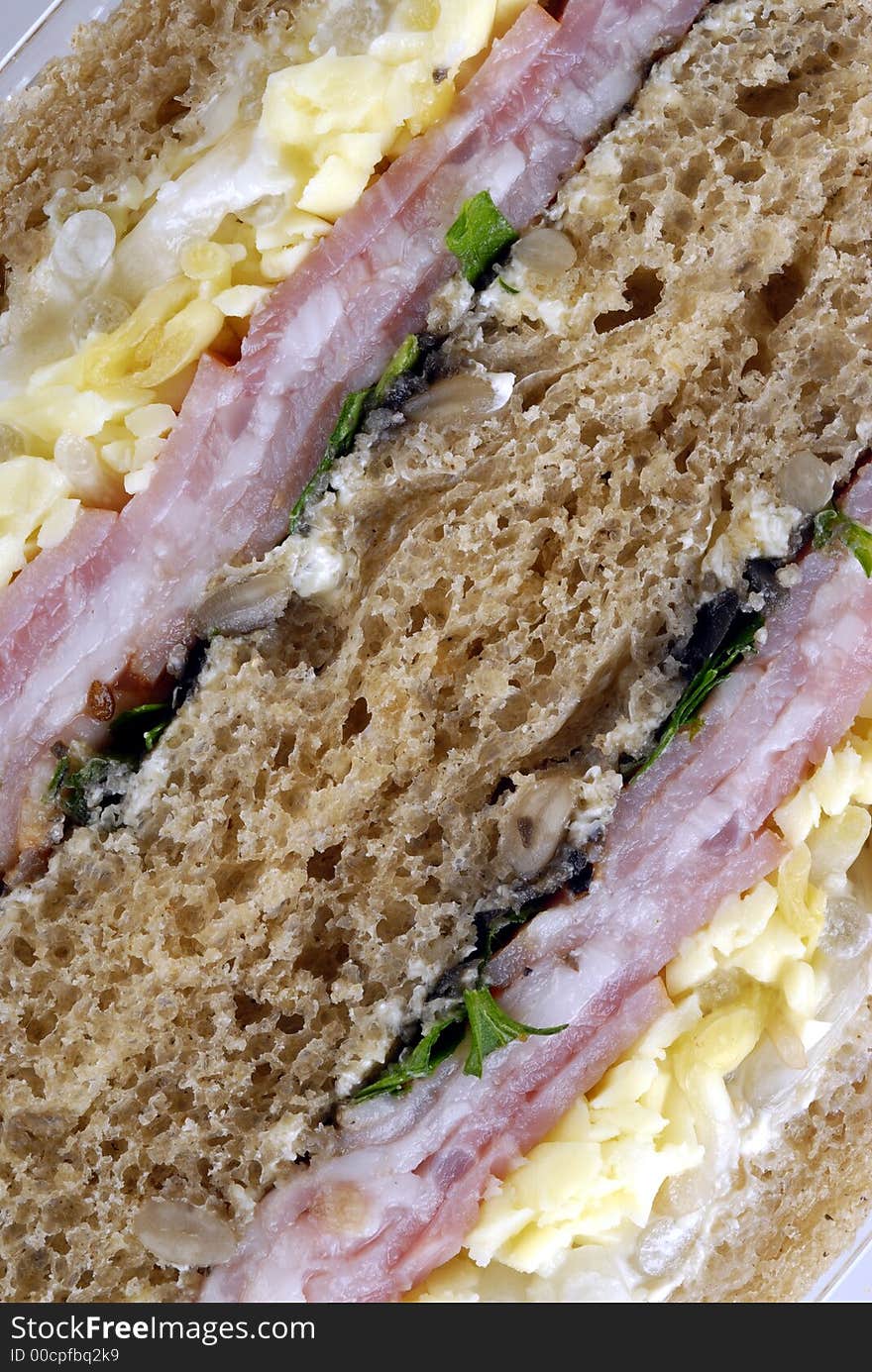 Close-up sandwich
with ham and vegetables. Close-up sandwich
with ham and vegetables