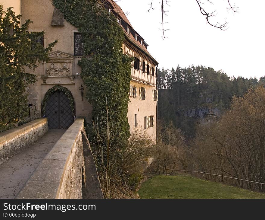 Bavarian castle and bridge in the evening sun