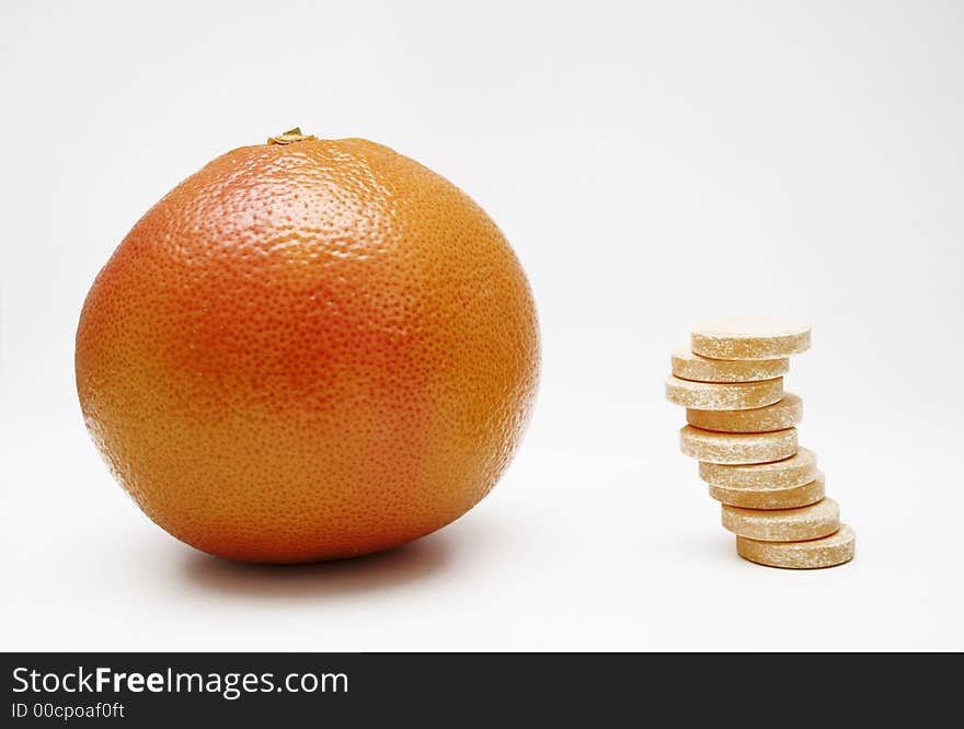 Red grapefruit face pills, isolated on white surface. Red grapefruit face pills, isolated on white surface